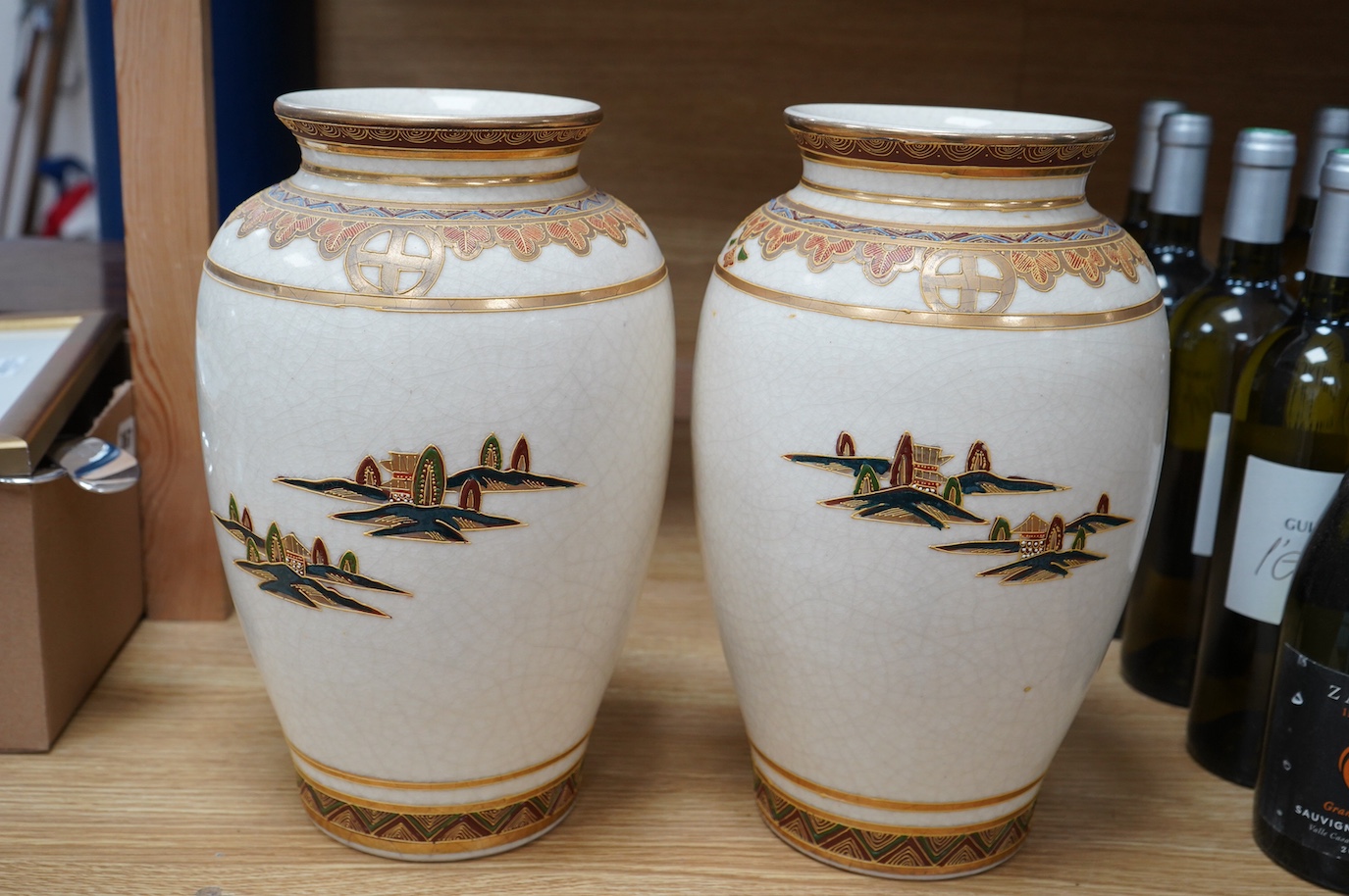 A pair of 20th century Japanese satsuma pottery vases, 32cm high. Condition - crazing throughout